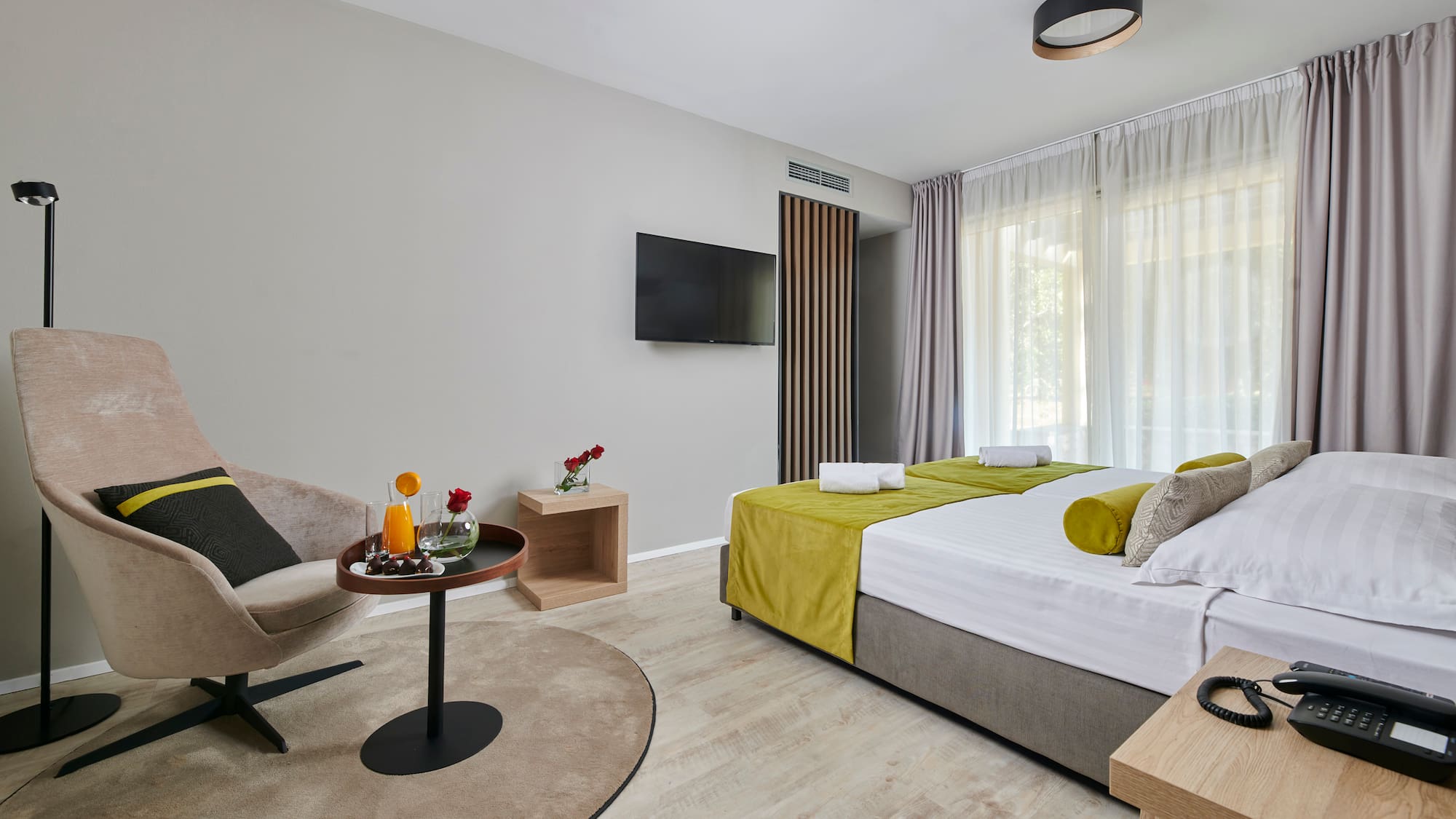 a room with a bed and a television