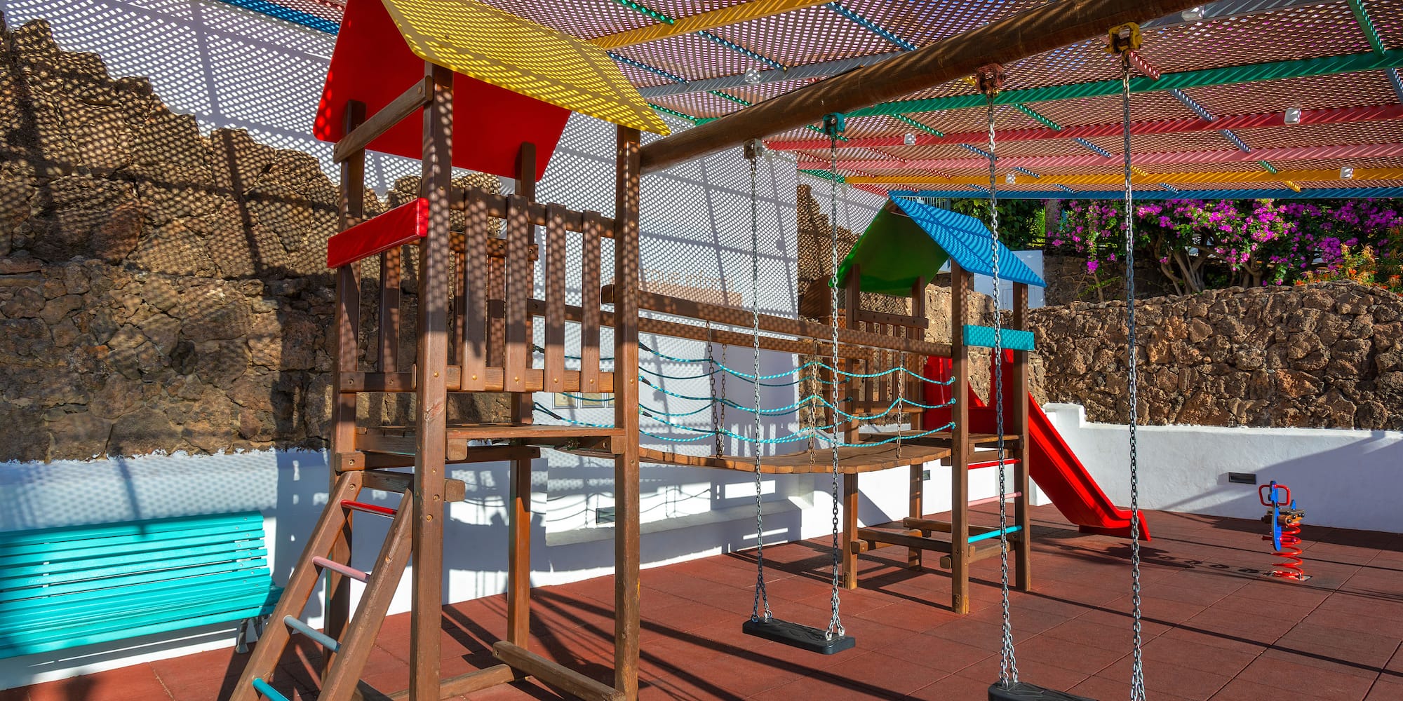 a playground with swings and a swing set