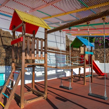 a playground with swings and a swing set