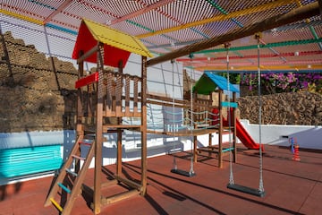 a playground with swings and a swing set