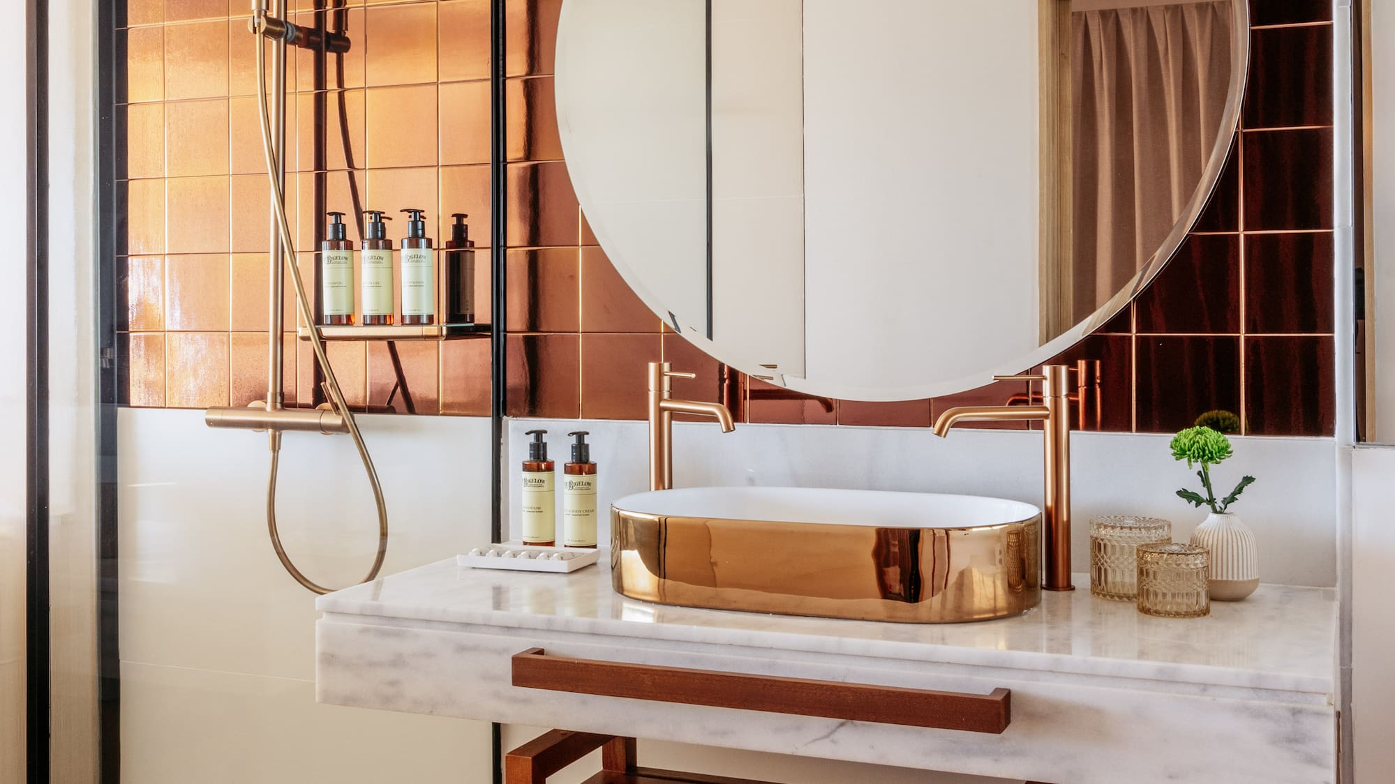 a bathroom with a round mirror