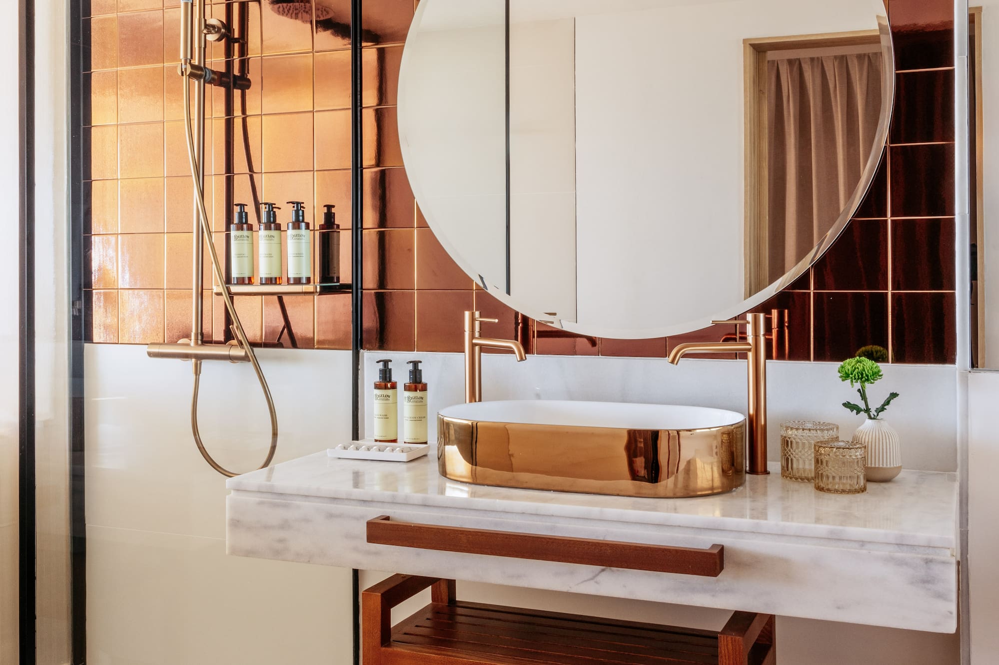 a bathroom with a round mirror