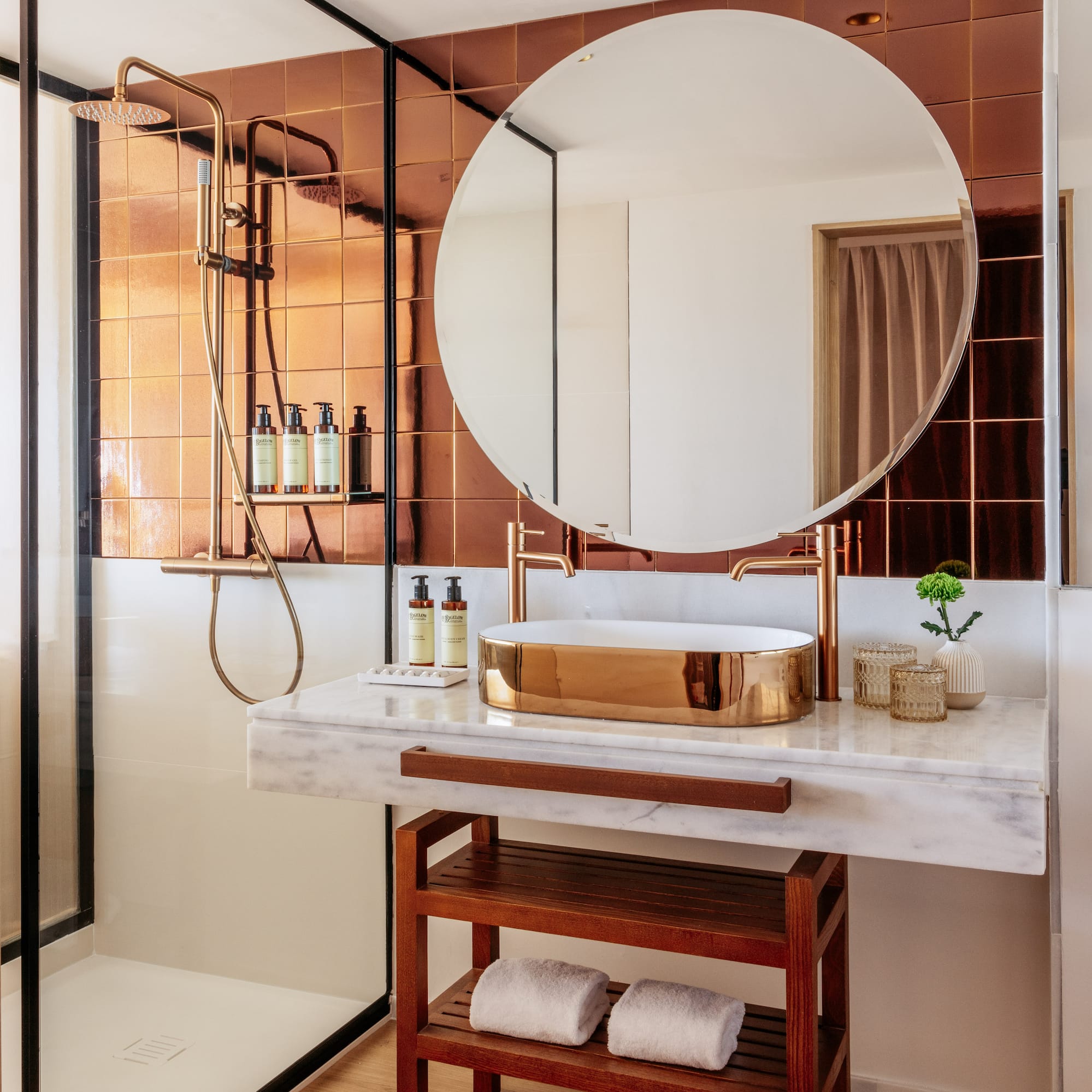 a bathroom with a round mirror