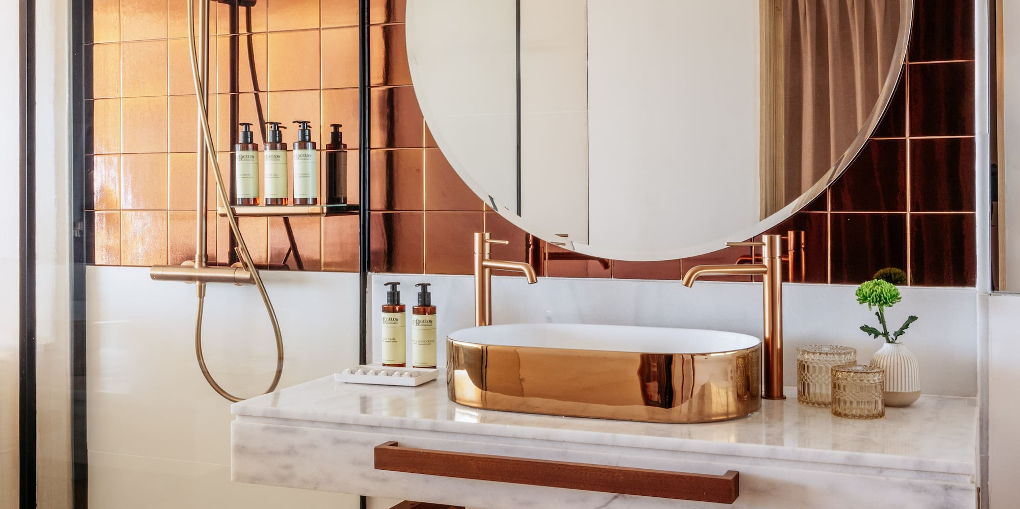 a bathroom with a round mirror