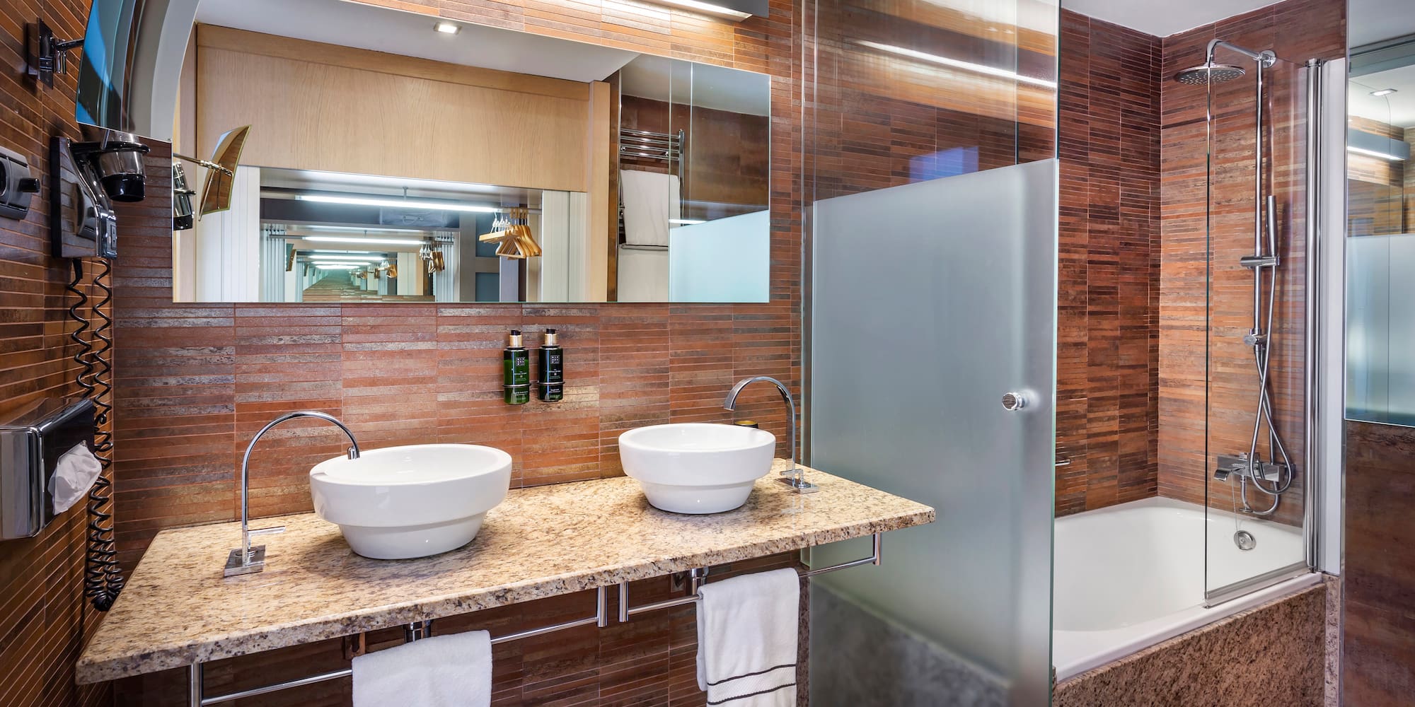 a bathroom with a shower and sink