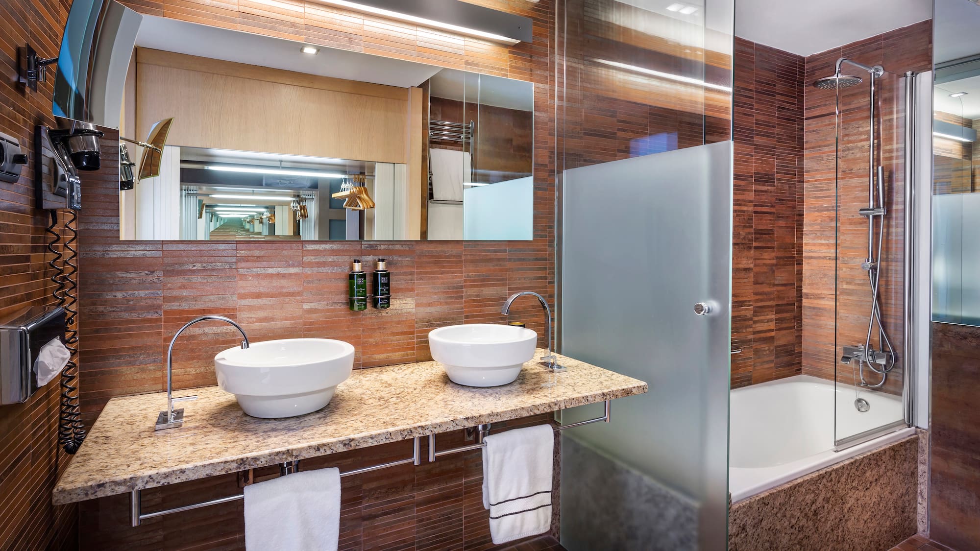 a bathroom with a shower and sink