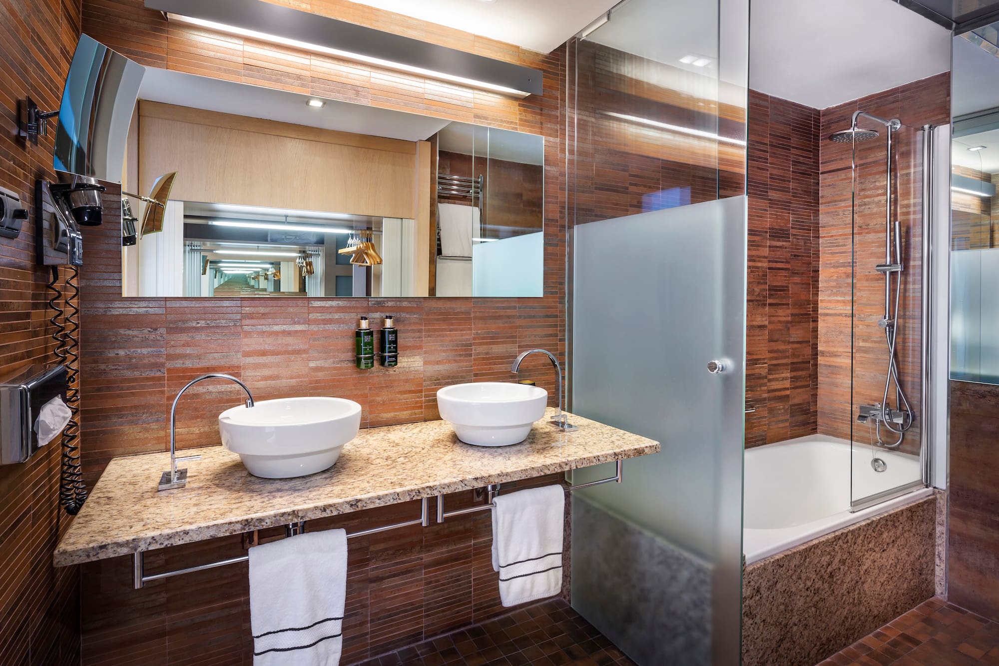 a bathroom with a shower and sink