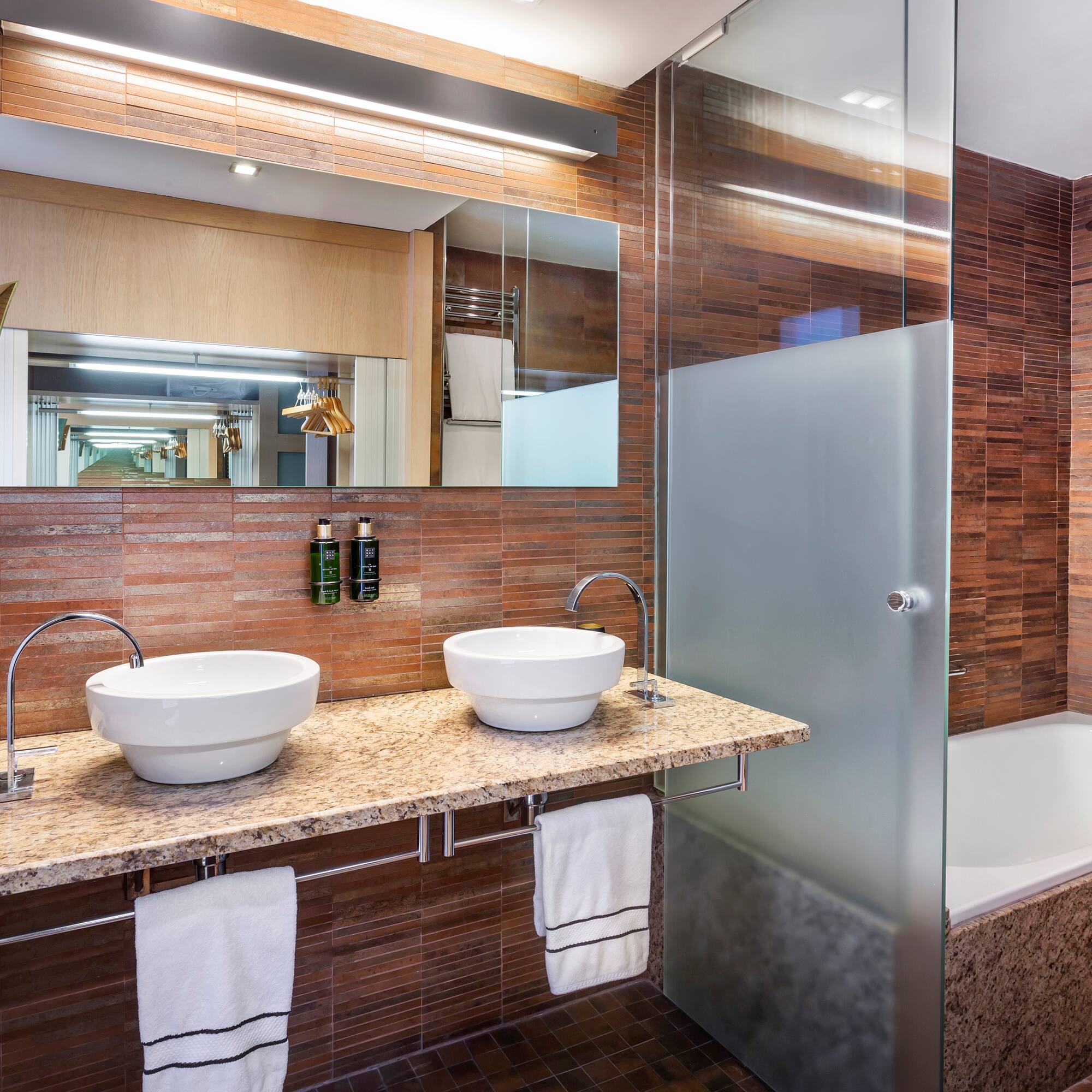 a bathroom with a shower and sink