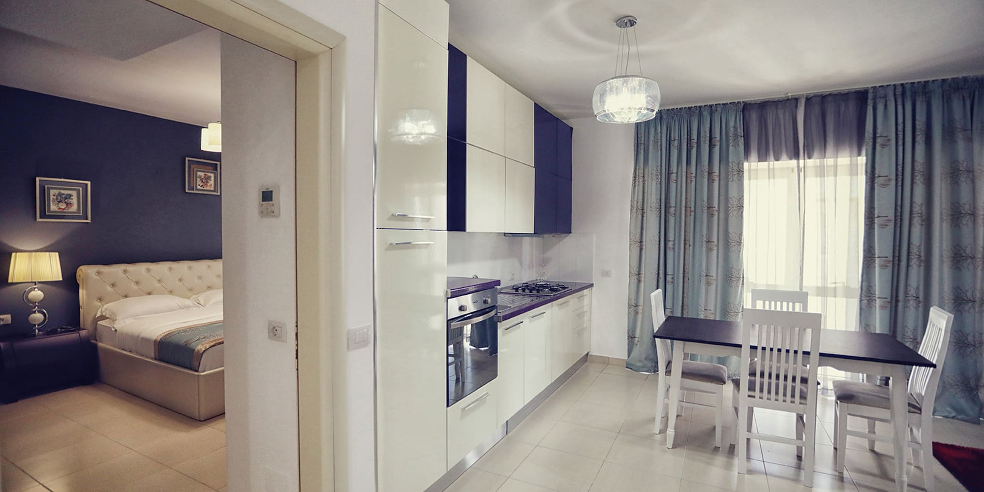 a kitchen with a table and chairs