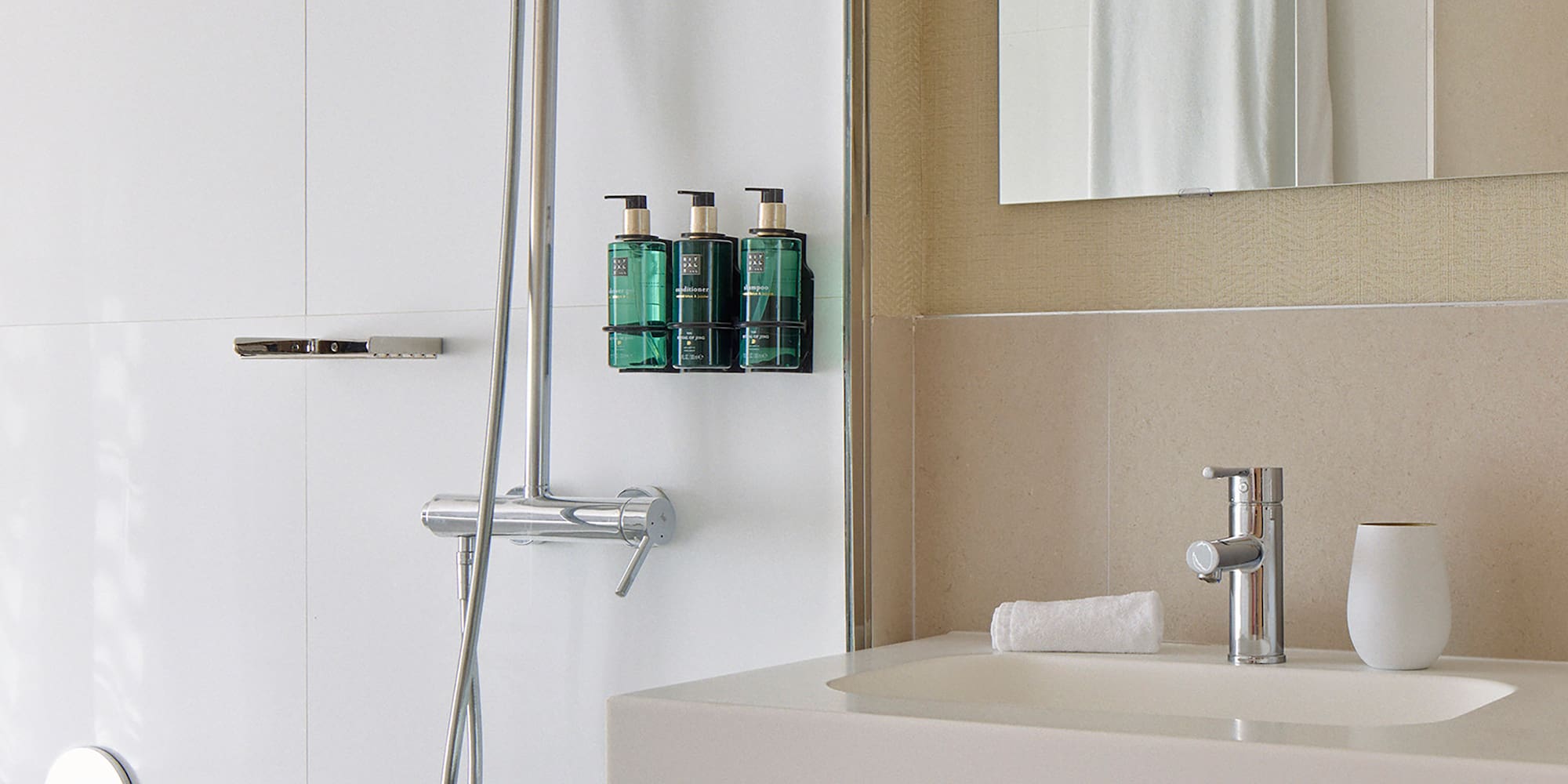 a bathroom with a shower and a sink