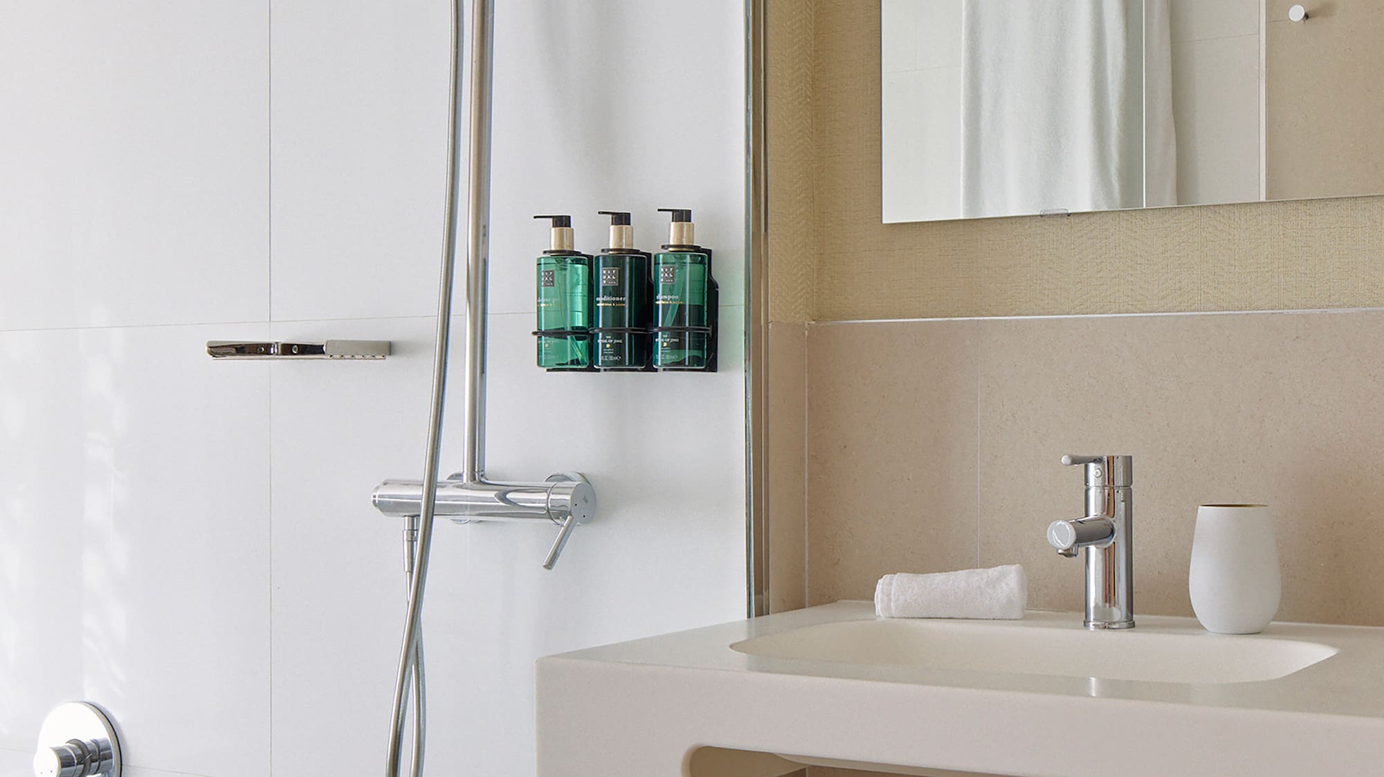 a bathroom with a shower and a sink