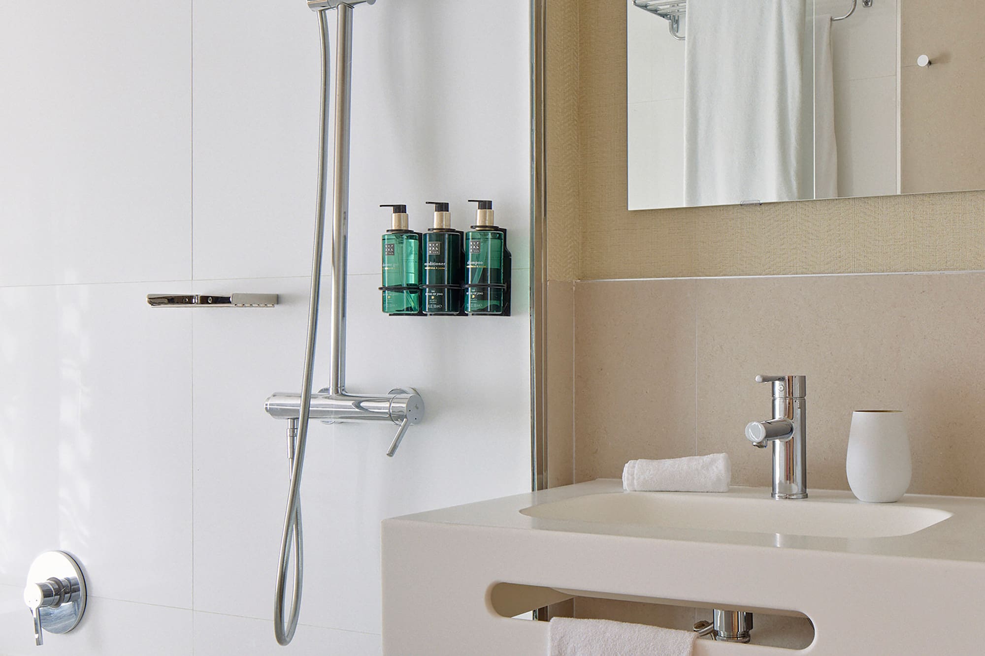 a bathroom with a shower and a sink