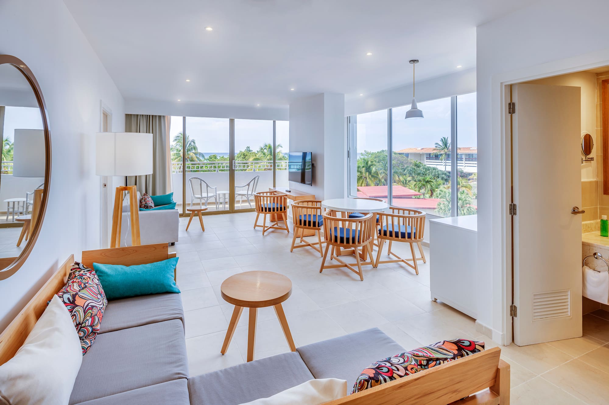 a room with a couch and chairs and a table