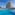Sunny resort hotel with large outdoor swimming pool and lounge area.