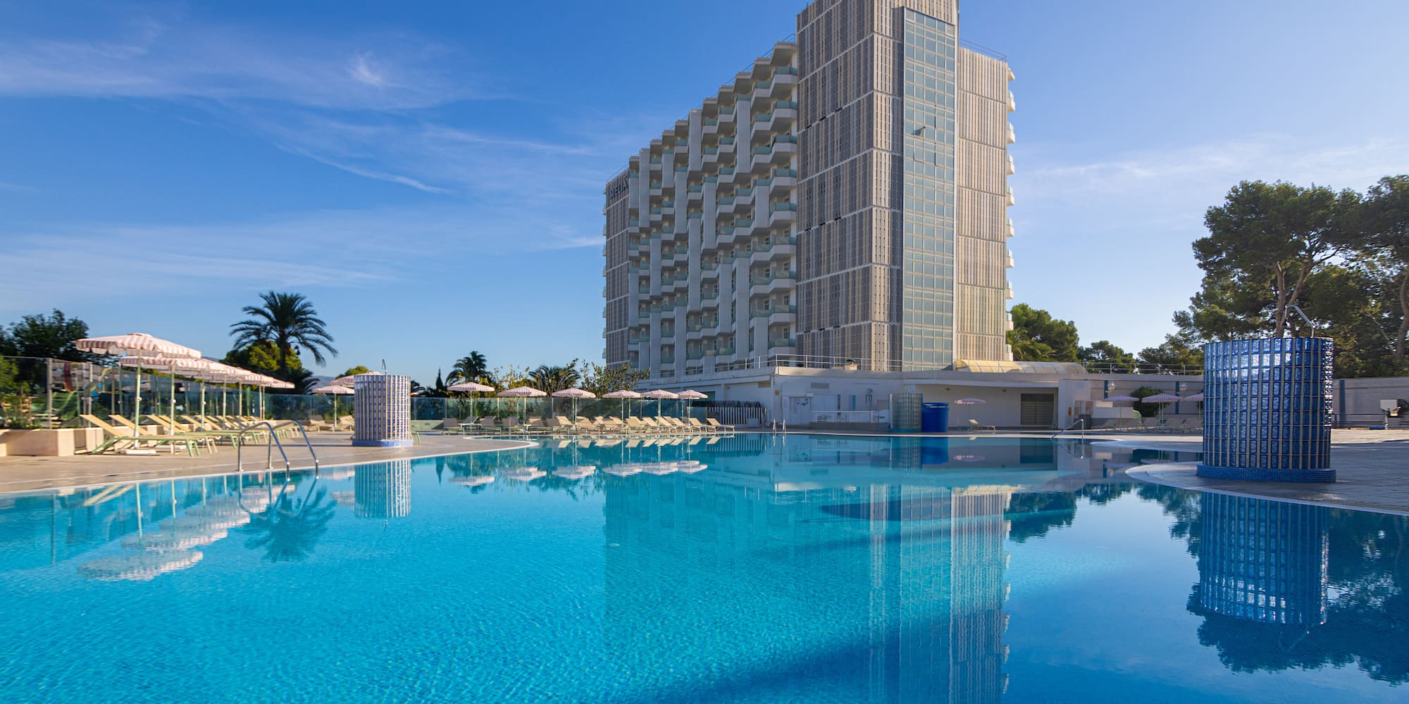a large building next to a pool