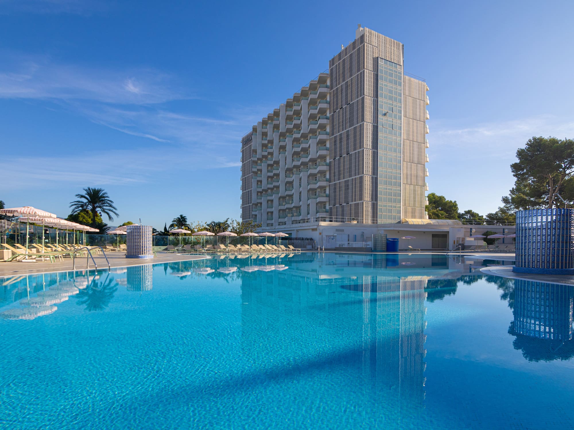 a large building next to a pool