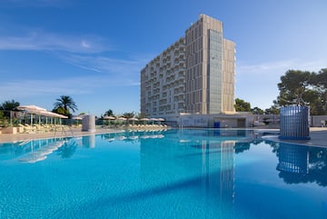 a large building next to a pool