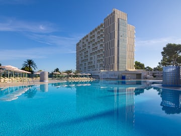 a large building next to a pool