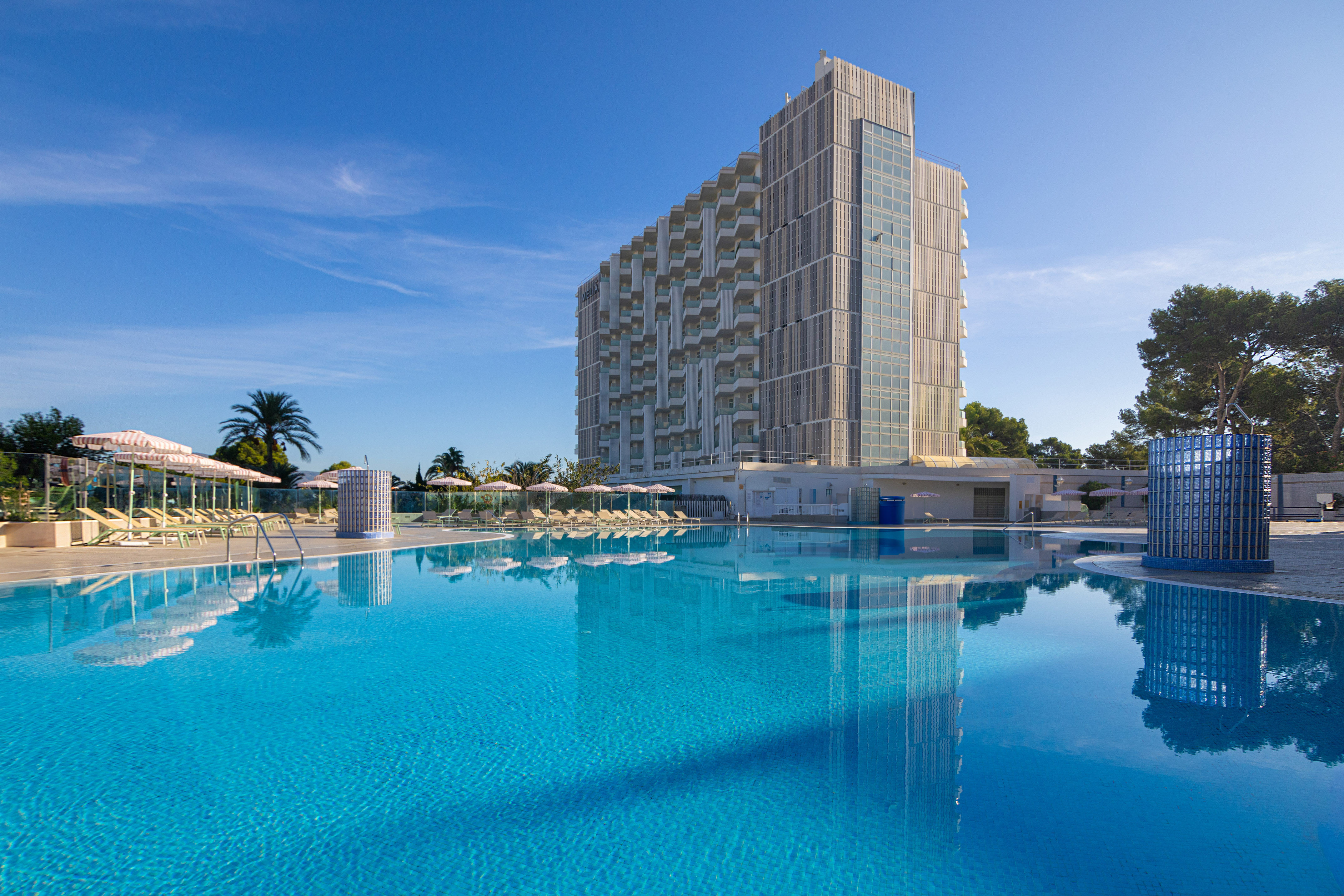 a large building next to a pool