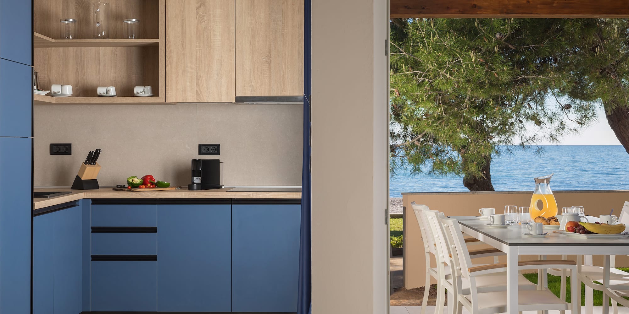 a kitchen with a table and chairs