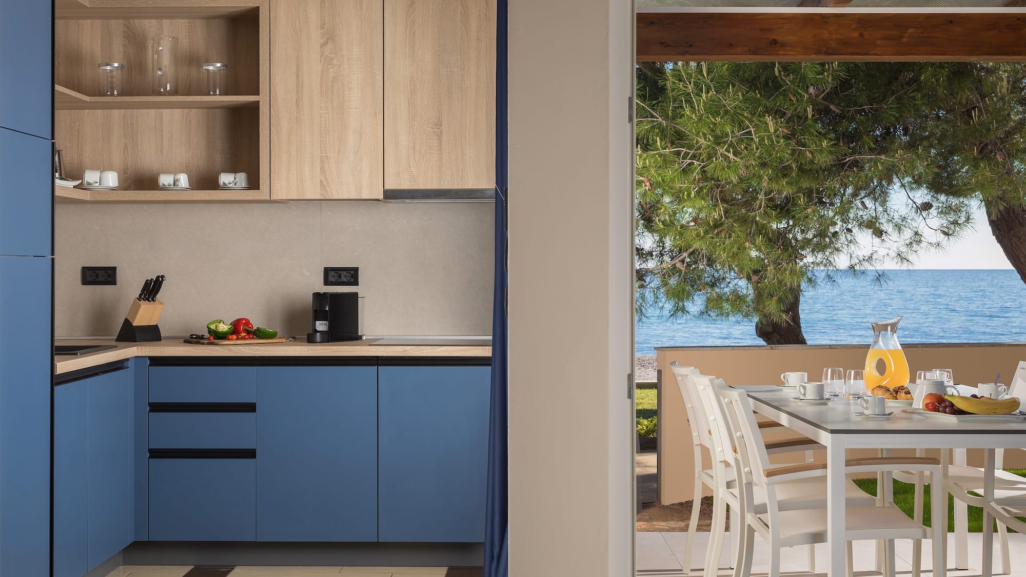 a kitchen with a table and chairs