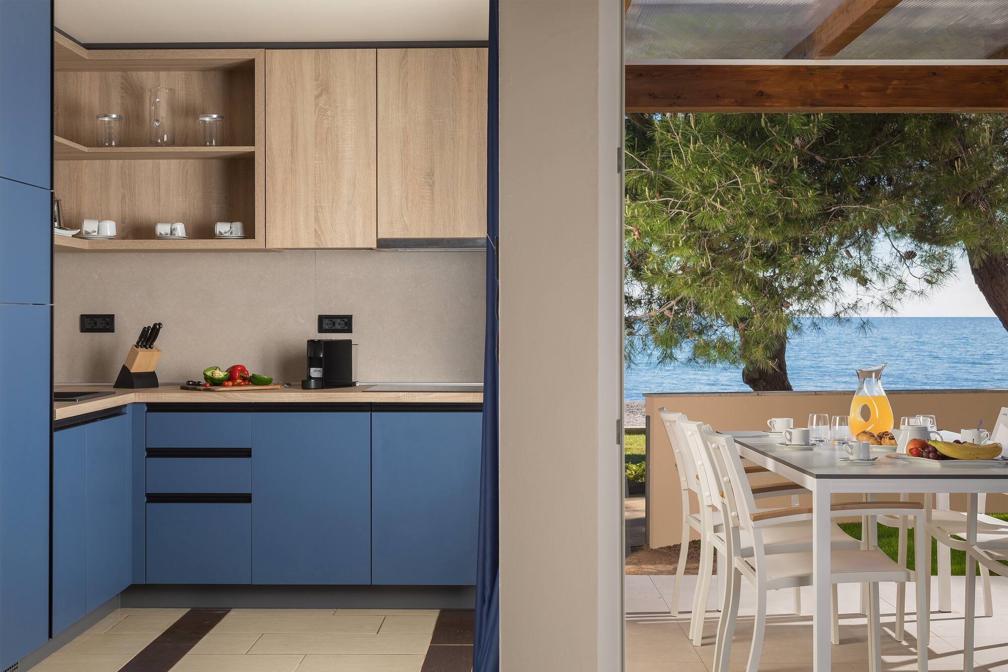 a kitchen with a table and chairs