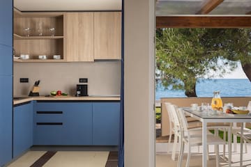 a kitchen with a table and chairs