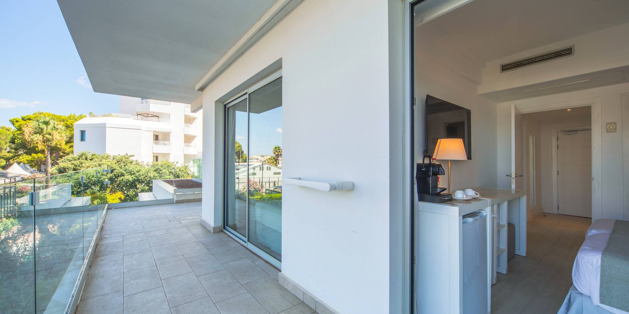 a glass door to a white building