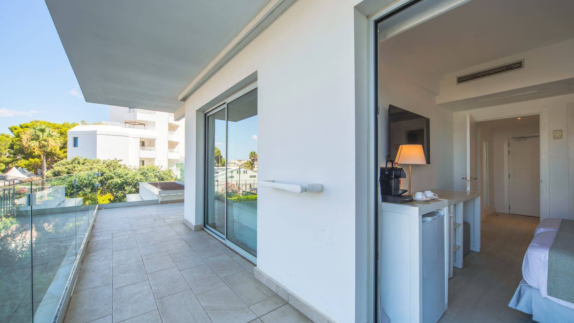 a glass door to a white building