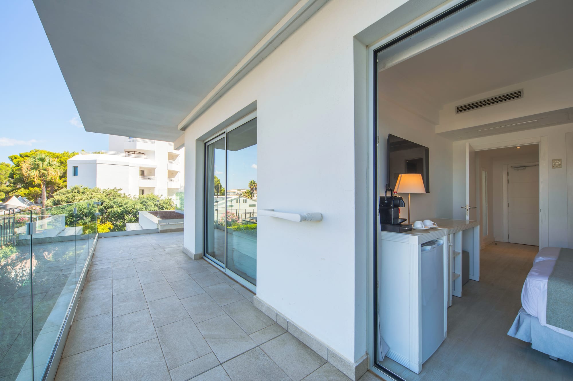 a glass door to a white building