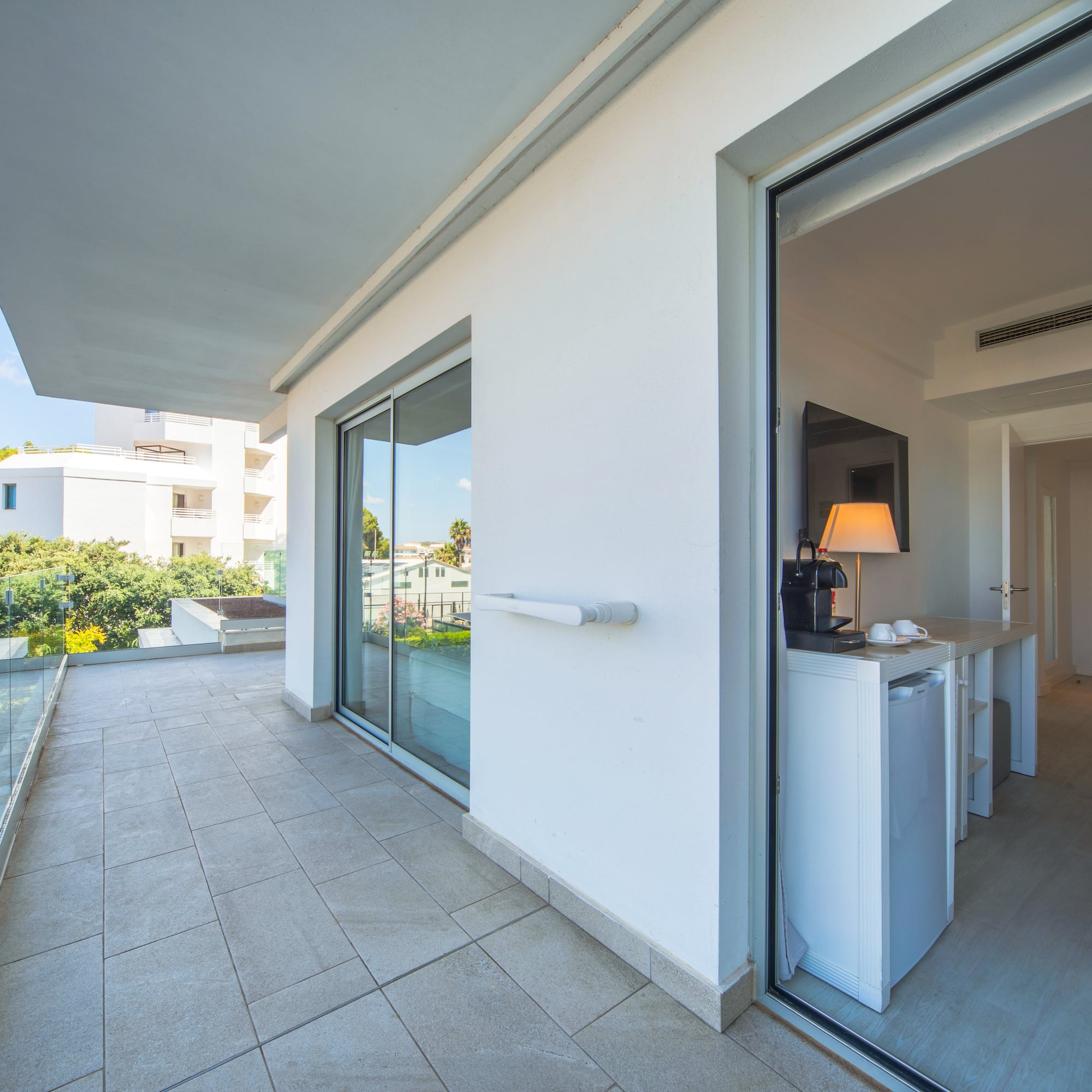 a glass door to a white building
