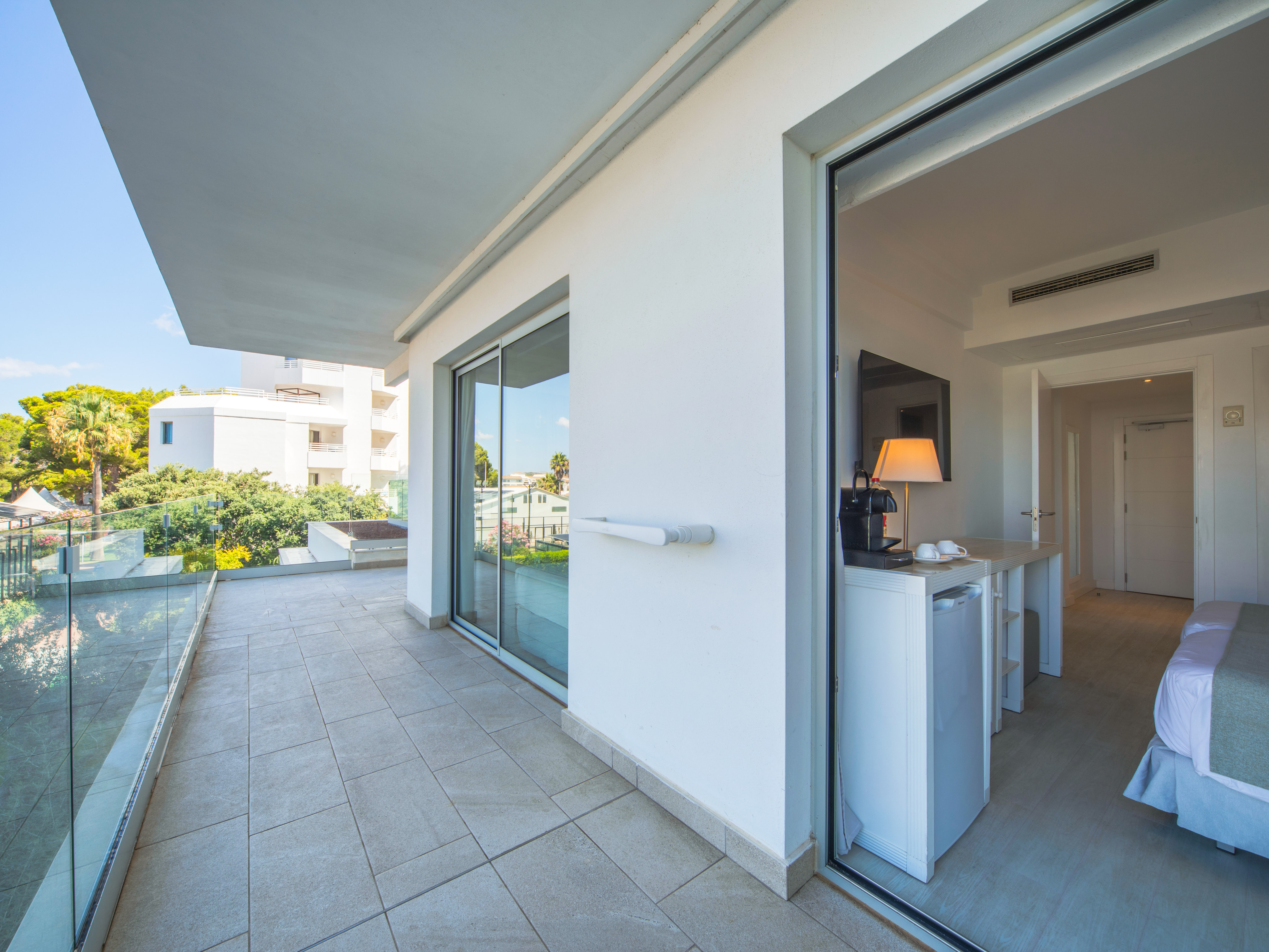 a glass door to a white building