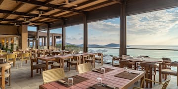 a restaurant with tables and chairs