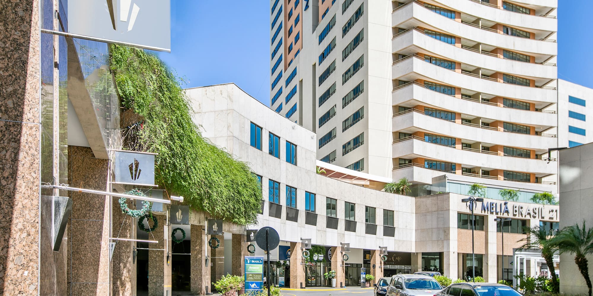 a street with cars parked in front of a building