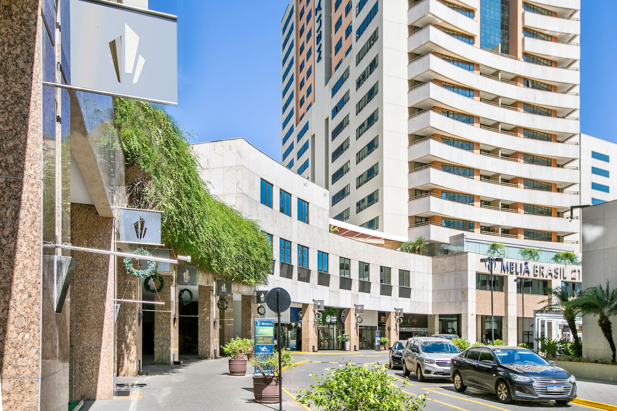a street with cars parked in front of a building