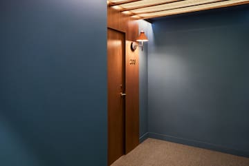 a door with a light on the wall