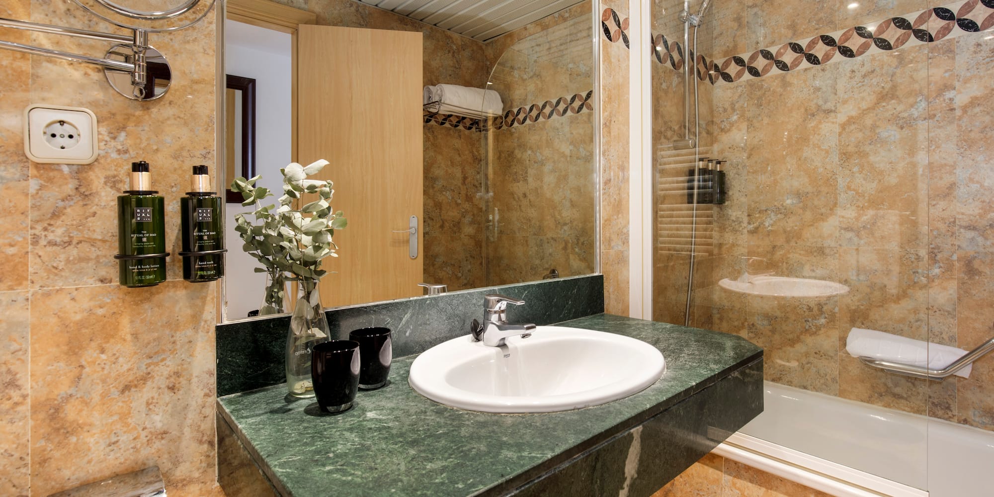 a bathroom with a sink and shower