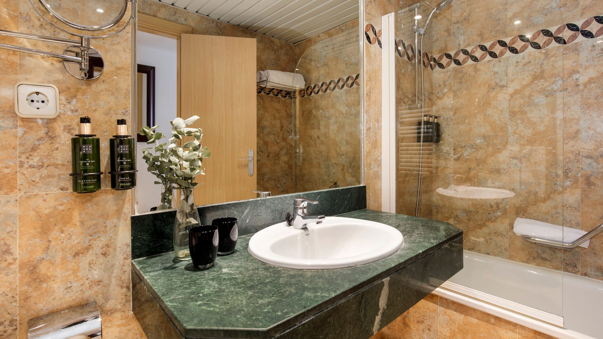 a bathroom with a sink and shower