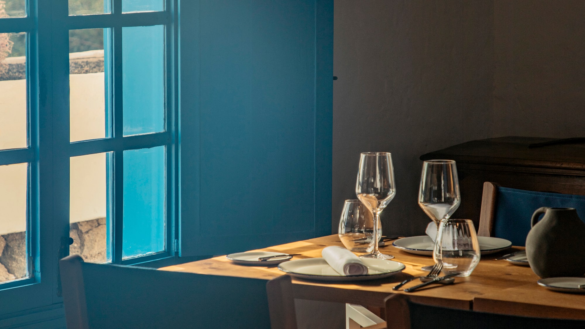 a table with glasses and plates on it