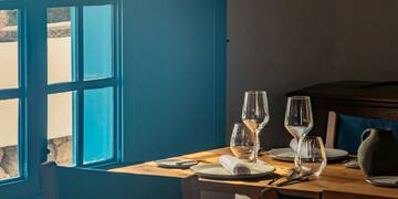 a table with glasses and plates on it