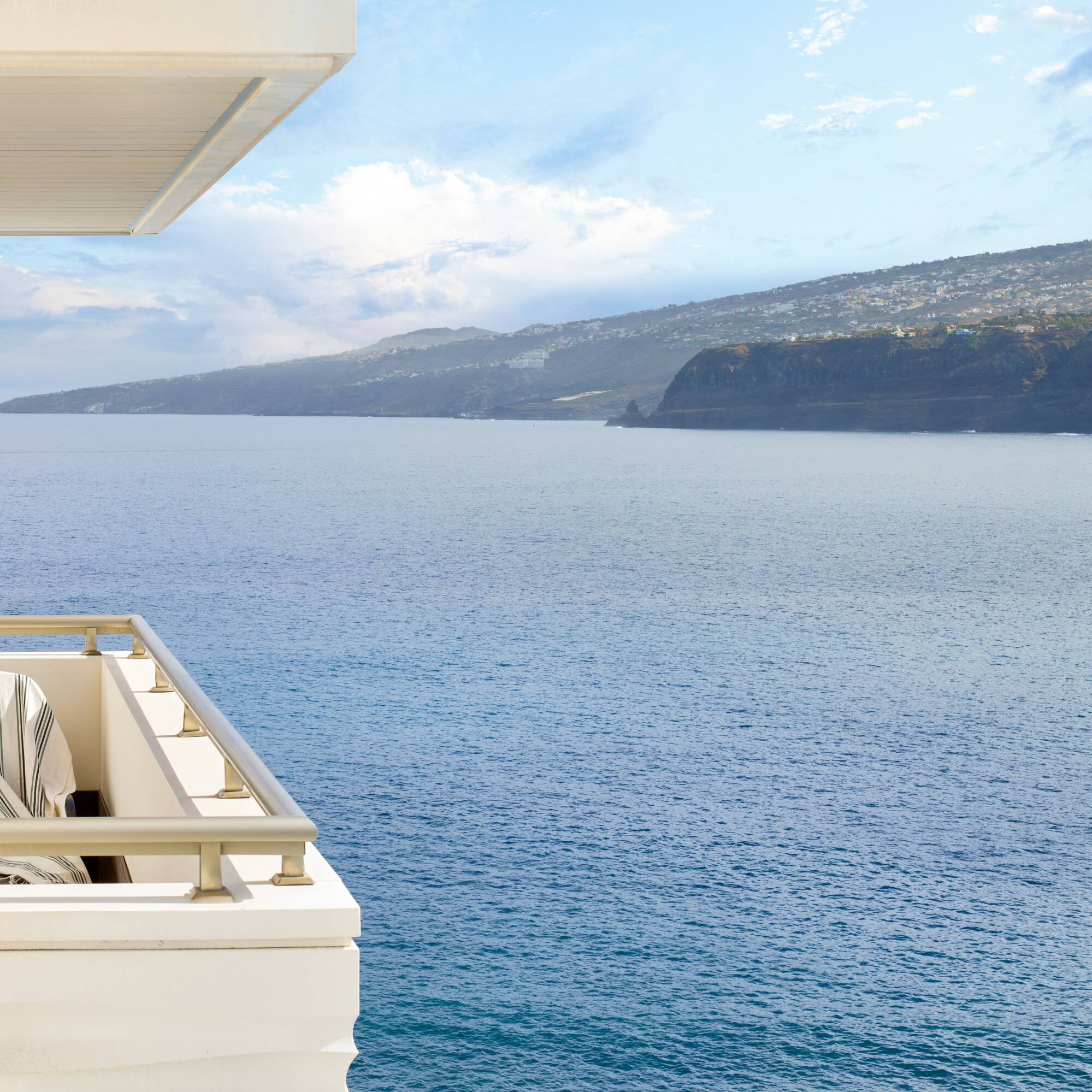 a balcony overlooking a body of water