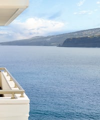 a balcony overlooking a body of water