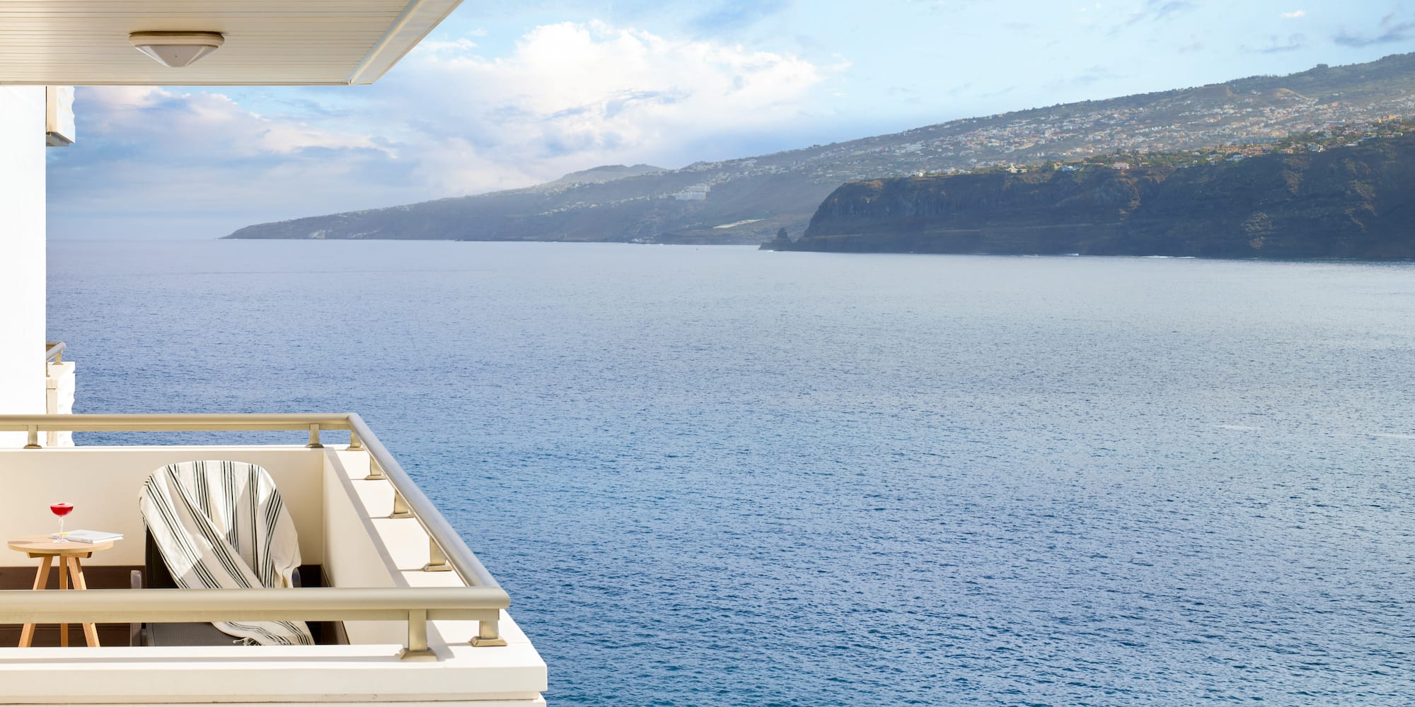 a balcony overlooking a body of water