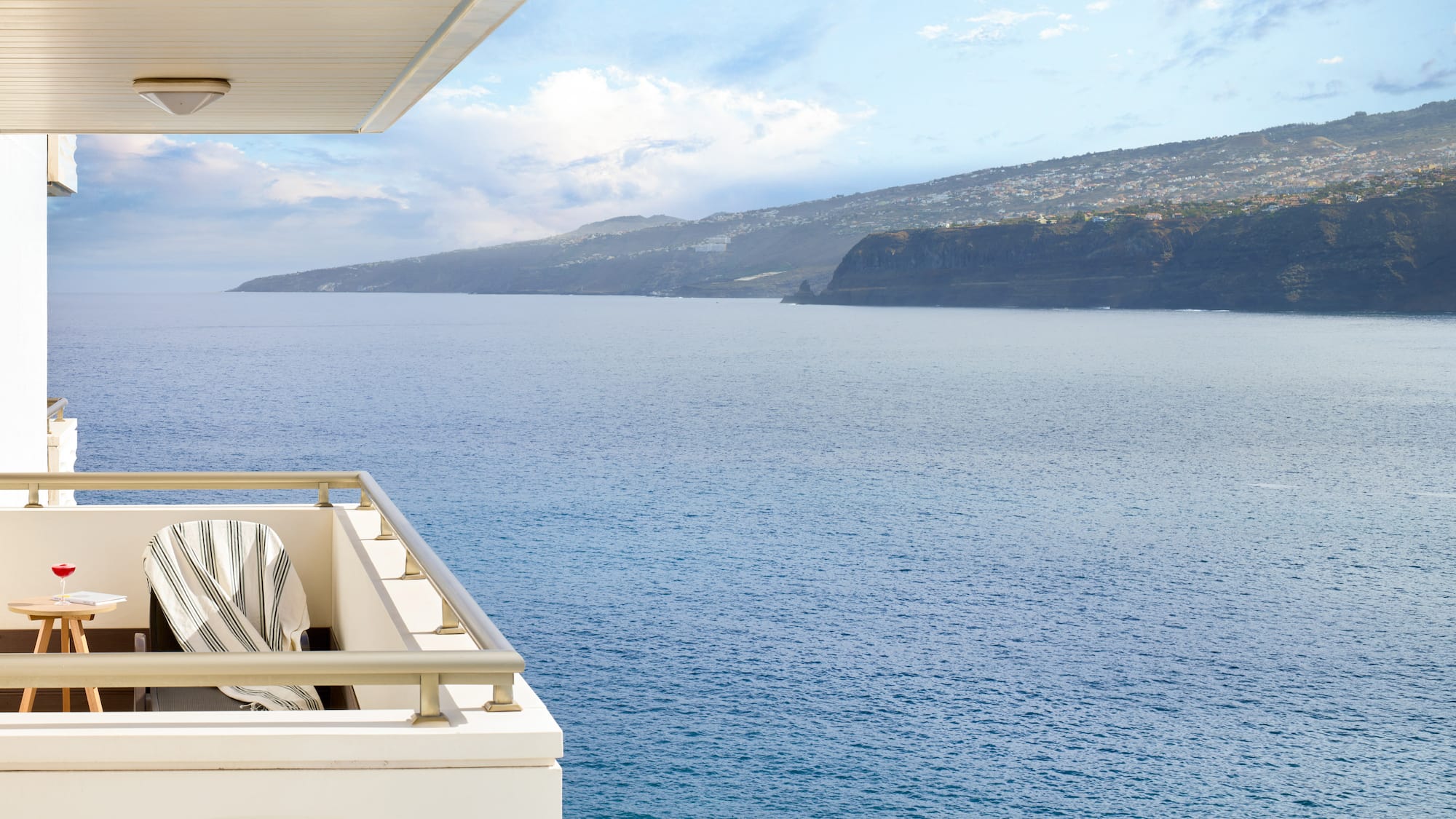a balcony overlooking a body of water