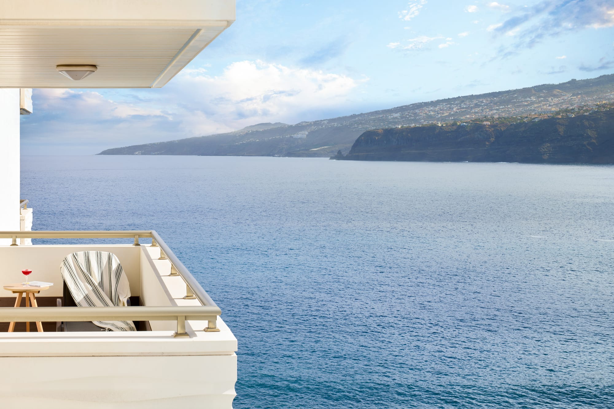 a balcony overlooking a body of water