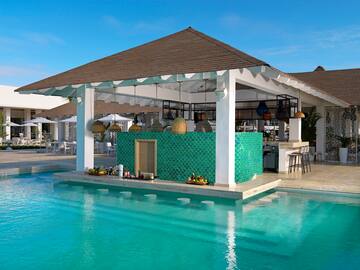 a pool with a bar and a bar