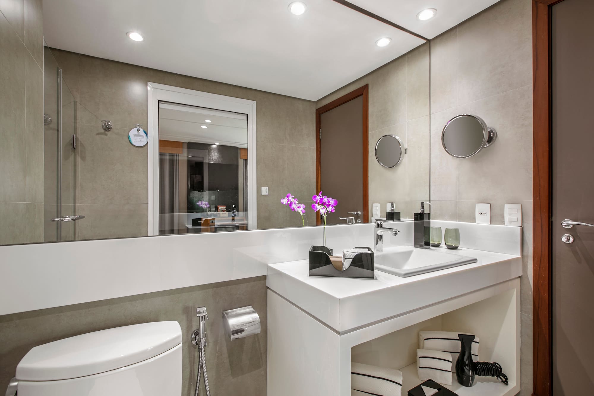 a bathroom with a sink and toilet