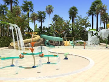 a water park with trees and a blue sky