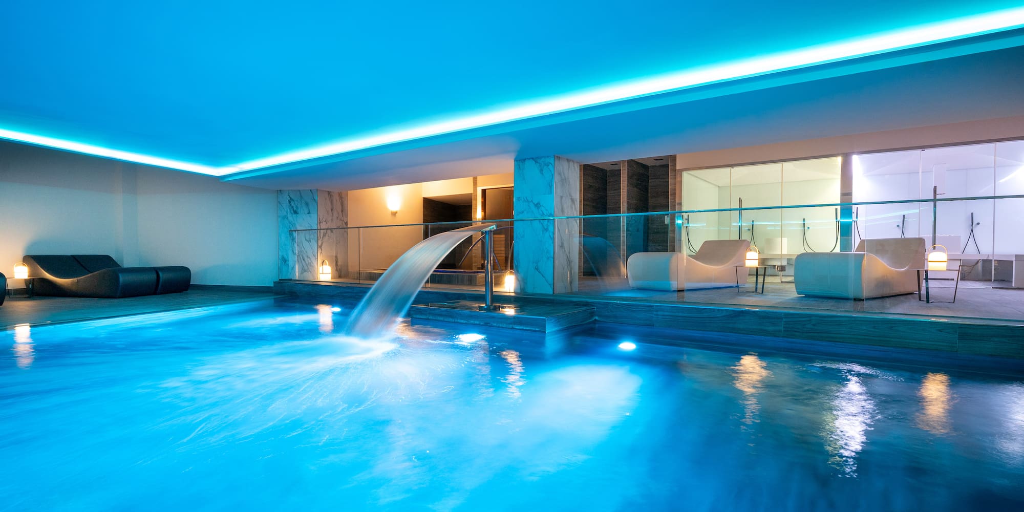 a pool with a waterfall