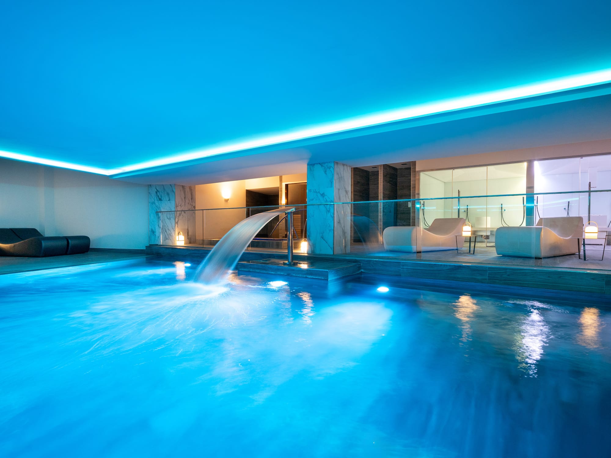 a pool with a waterfall